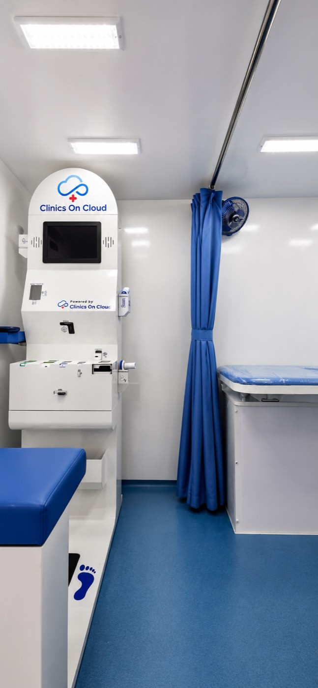 The screening zone inside a Mobile Medical Unit - health kiosk, privacy curtain and examination bed